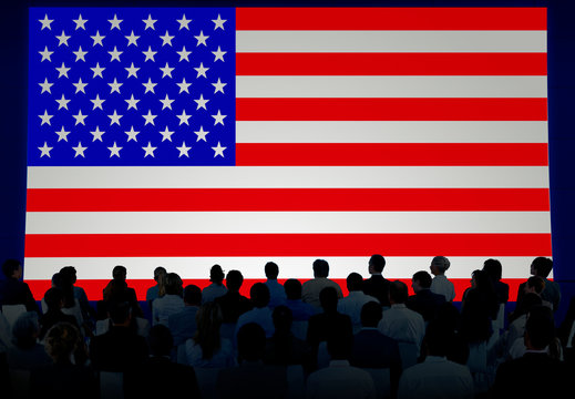 Silhouettes Of Business People Looking At The American Flag