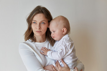 Mother and son in white clothes