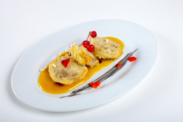 Dishes in white plates on a white background with the application of food design.