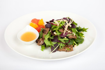 Dishes in white plates on a white background with the application of food design.