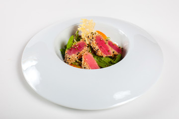 Dishes in white plates on a white background with the application of food design.