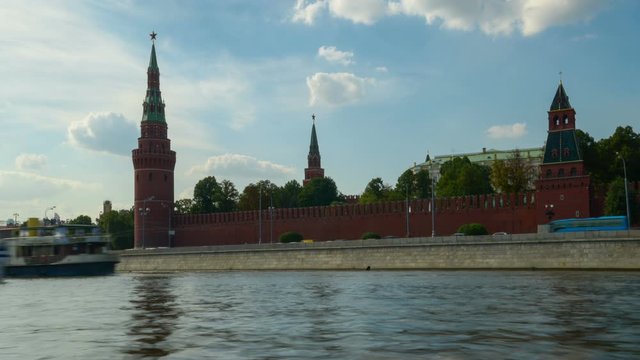 Timelapse. Ships pass along the Moscow River against the backdrop of the Moscow Kremlin.