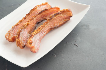 slice of bacon on plate torrezno