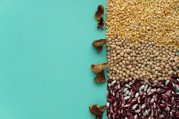 Different legumes and dried mushrooms - beans, chickpeas and peas. Vegetarian nutritional concept.