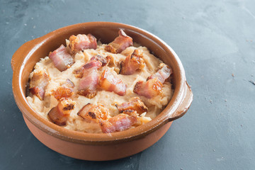mashed potatoes with slice of bacon