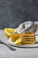 home cooking pancakes with lemon jam on a white craft plate. family Breakfast dish, food for children in the morning.  pancakes recipe