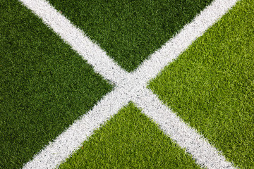 White stripe on the green soccer field from top view