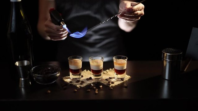 Bartender lighting B-52 cocktail