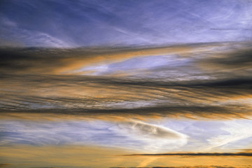 Peculiar cloud formations Tinted by the Setting Sun