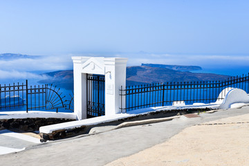Gate and fence above  Aegean Sea at Imerovigli, Santorini, Greece