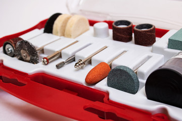 Set of nozzles for engraver in plastic box on white background