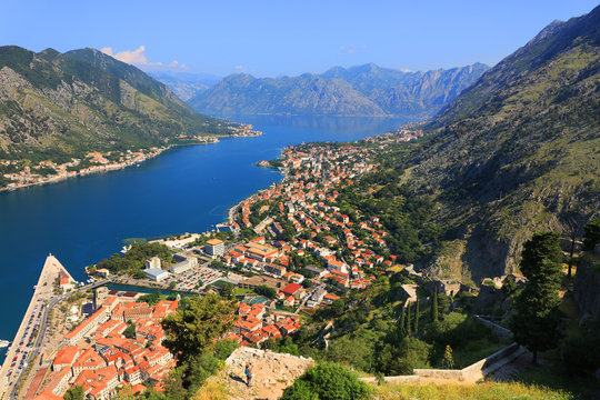 Aerial beautiful View of Kotor bay. Cruise ship docked in beautiful summer day. View of kotor old town from Lovcen mountain in Kotor, Montenegro. Kotor is part of the unesco world.