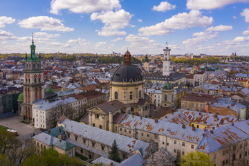 Obraz premium Aerial view on Dominican Church, Dormition Church and City Hall in Lviv, Ukraine from drone