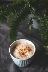 Cappuccino in beautiful cup on the table