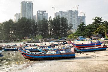 Fototapeta na wymiar Timber fishing boats moored on the beach Penang