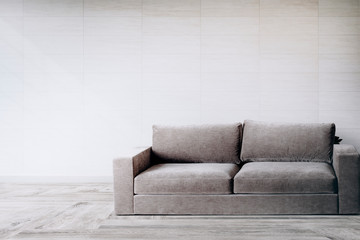 Gray couch against a wall mockup