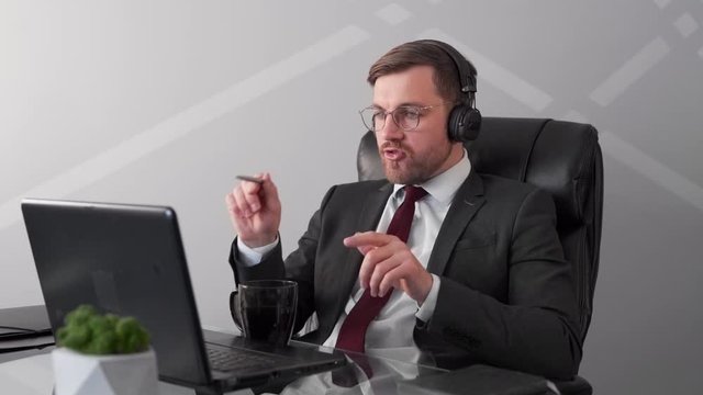 Handsome young man holds online talks