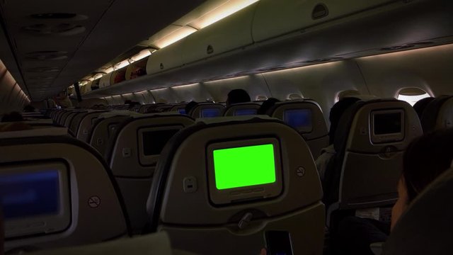 Monitor with Green Screen On Passenger Seat Of an Airplane. You can replace green screen with the footage or picture you want. You can do it with “Keying” effect in After Effects.