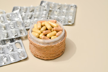 Assortedpharmaceuticals antibiotics pills medicine. colorful antibacterials pills on beige background. capsule pill medicine. Simbol of 2020 year, cronavirus broblem