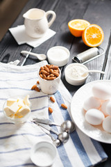 almonds in a white porcelain Cup on the table with baking ingredients