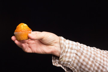 industrial cupcake in hand