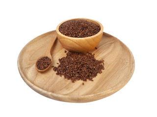Flax seed placed in a wooden tray, wooden spoon, wooden cup on a white background