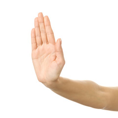 Stop it! Woman hand gesturing isolated on white