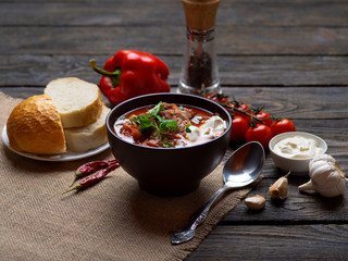 first course homemade hot Russian borscht with meat sour cream