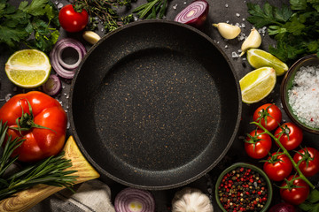 Ingredients for cooking at black table.