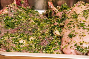 raw meats marinated in garlic olive oil parsley salt pepper