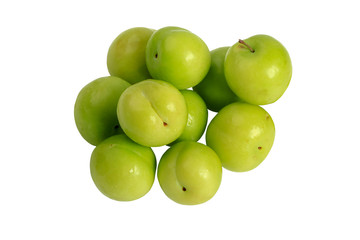 Green plums isolated on a white background. Close-up. Top view.