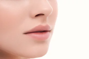 Muurstickers Closeup perfect natural lip makeup. Beautiful plump full lips on female face. Spa tender lips. Blank Space © Антон Пухов