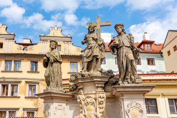 Fototapeta na wymiar Statues of Saints Cosmas and Damians on Charles bridge in Prague, Czech Republic
