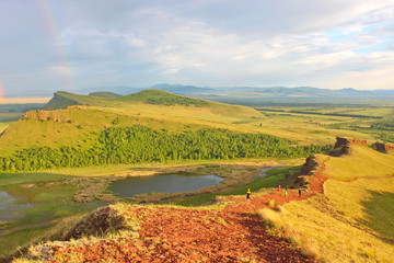 bright double rainbow over green hills, Khakassia