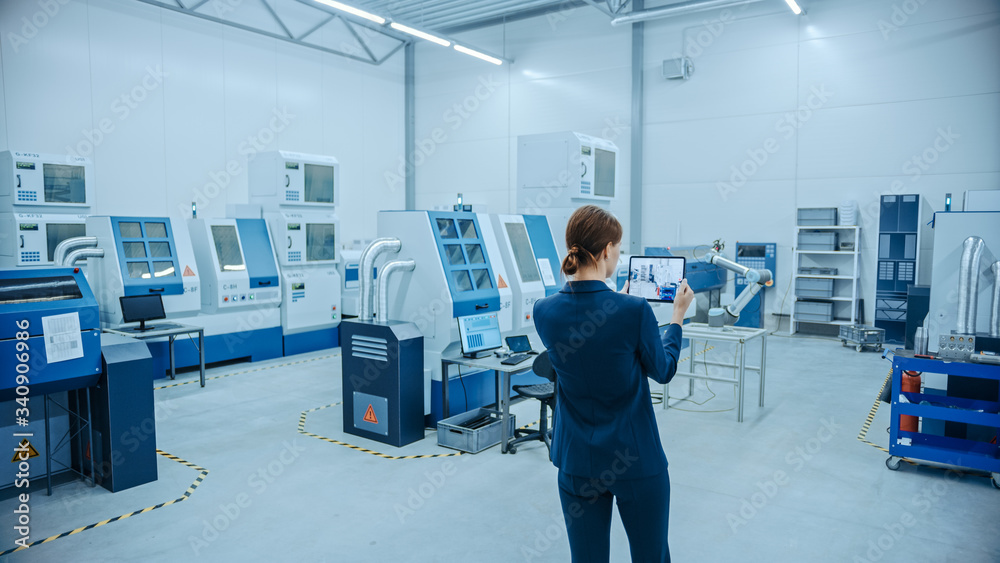 Leinwandbilder modern factory: female engineer uses digital tablet computer with augmented reality software to visu