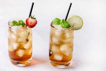 Glasses of Cold Citrus and Strawberry Ice Tea Decorated with Slice of Lemon and Strawberry Healthy Summer Drink Horizontal