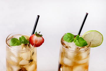 Glasses of Cold Citrus and Strawberry Ice Tea Decorated with Slice of Lemon and Strawberry Healthy Summer Drink Horizontal