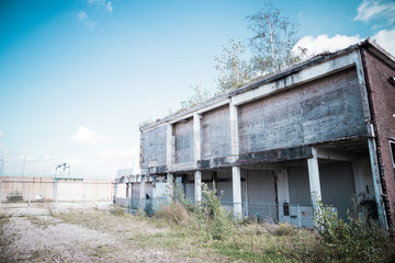 Fototapeta na wymiar Abandoned buildings near power plant 2