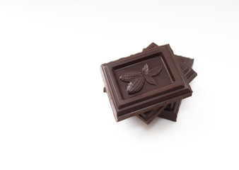 Three pieces of chocolate on a white background