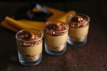 Three glasses with Coffee Cream Recipe, presented as a delicious dessert. dark food
