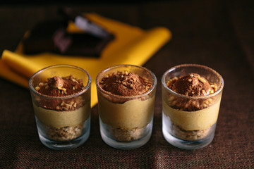 Three glasses with Coffee Cream Recipe, presented as a delicious dessert. dark food