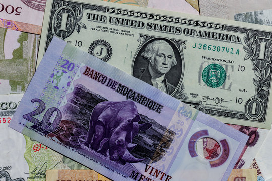 One  US Dollar with Different Mosambiqoe  Banknotes