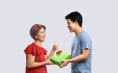 Mother day, mom receiving a gift from son