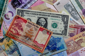 Fototapeta na wymiar Moscow, Russia - April 20, 2020: One US Dollar with Different Nepalese Rupee Banknotes