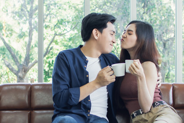 Couple is holding cups of coffee