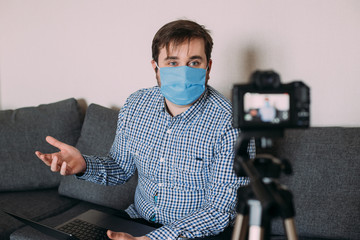 Portrait of blogger man recording video at home online influencer vlogger social media live streaming concept