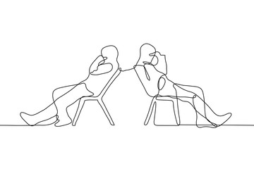 two men are sitting on chairs looking away from each other. The friends both had a hand in their face (fatigue, disappointment, facepalm). The concept of quarrel, intransigence, conflict, disagreement