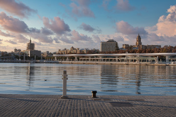 Panorama Malaga Cathedral and the Port of Malaga Promenade on a cloudy day from Quay 1.