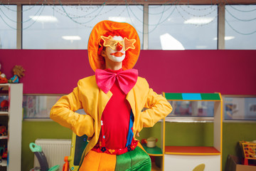 Funny clown in star glasses