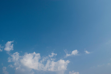 Naklejka na ściany i meble blue sky with natural white clouds. background summer sky.